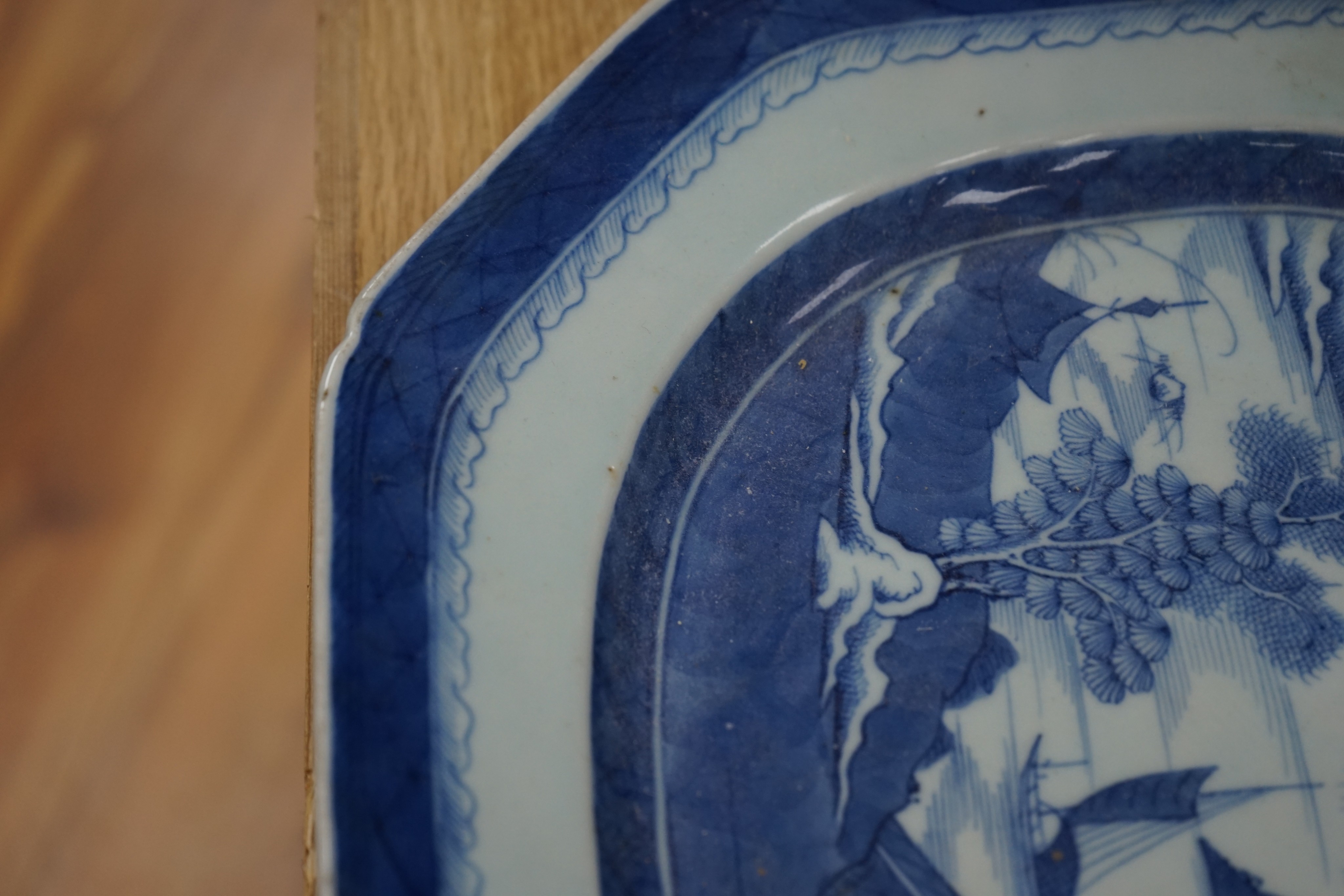 A 19th century Chinese Export blue and white octagonal meat dish, decorated with a lake scene, W 42cm